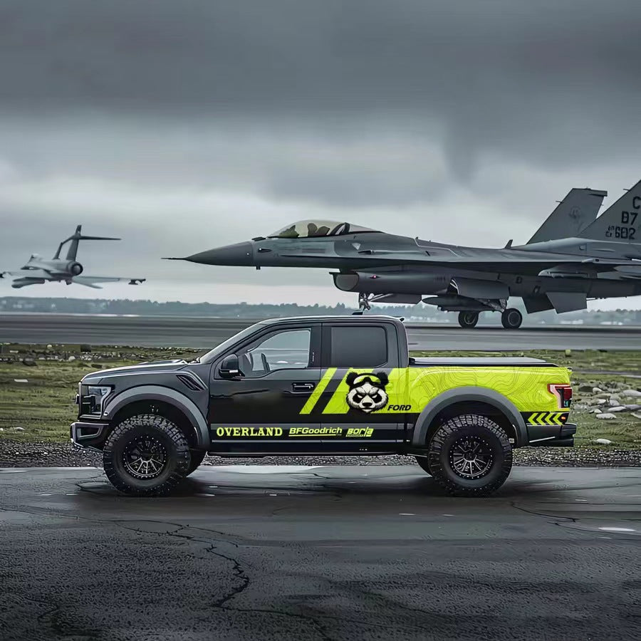 Panda overland vinyl wrap on black Ford F-150 – neon yellow and black side graphic, airfield background