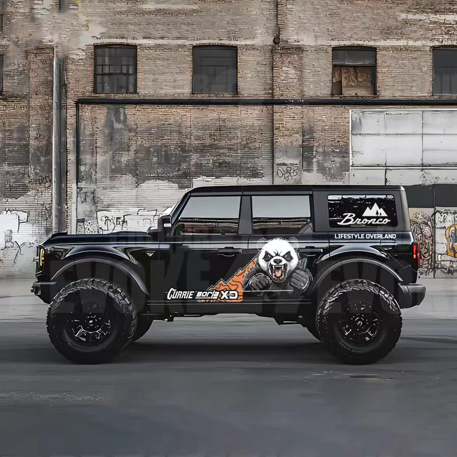 Angry panda cartoon decal applied on dark SUV – outdoor side profile view