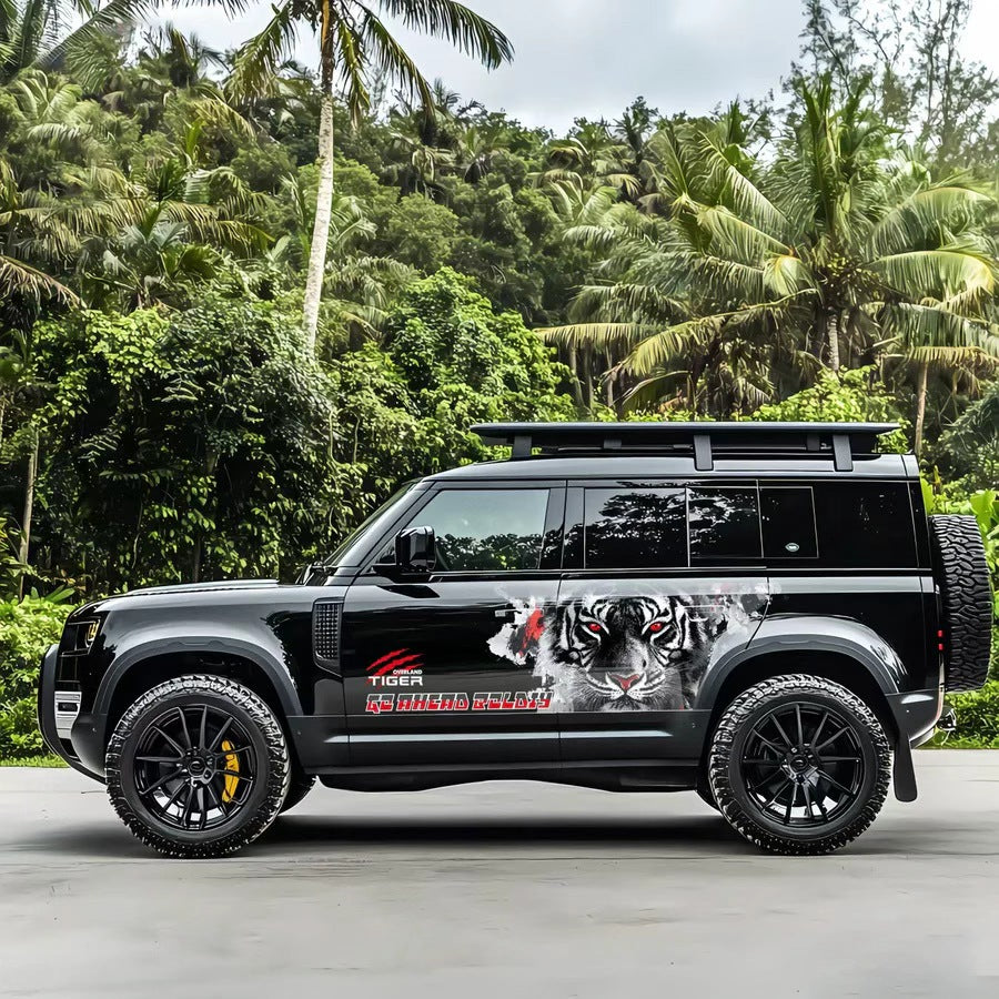 Bold Tiger SUV Decal – Front Face Aggressive Off-Road Side Vinyl Wrap on Black Defender in Tropical Scene