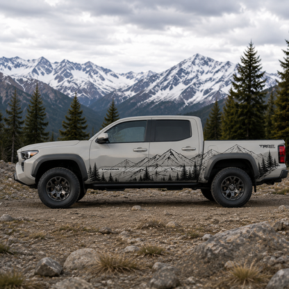 Mountain forest vinyl decal on Toyota Tacoma with alpine backdrop