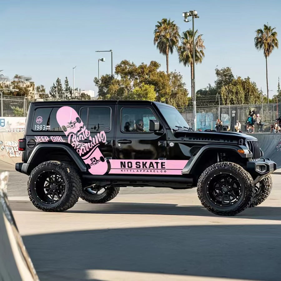 Black Jeep Wrangler with Pink Skateboard Street Style Side Stripe Vinyl Wrap near Palm Trees