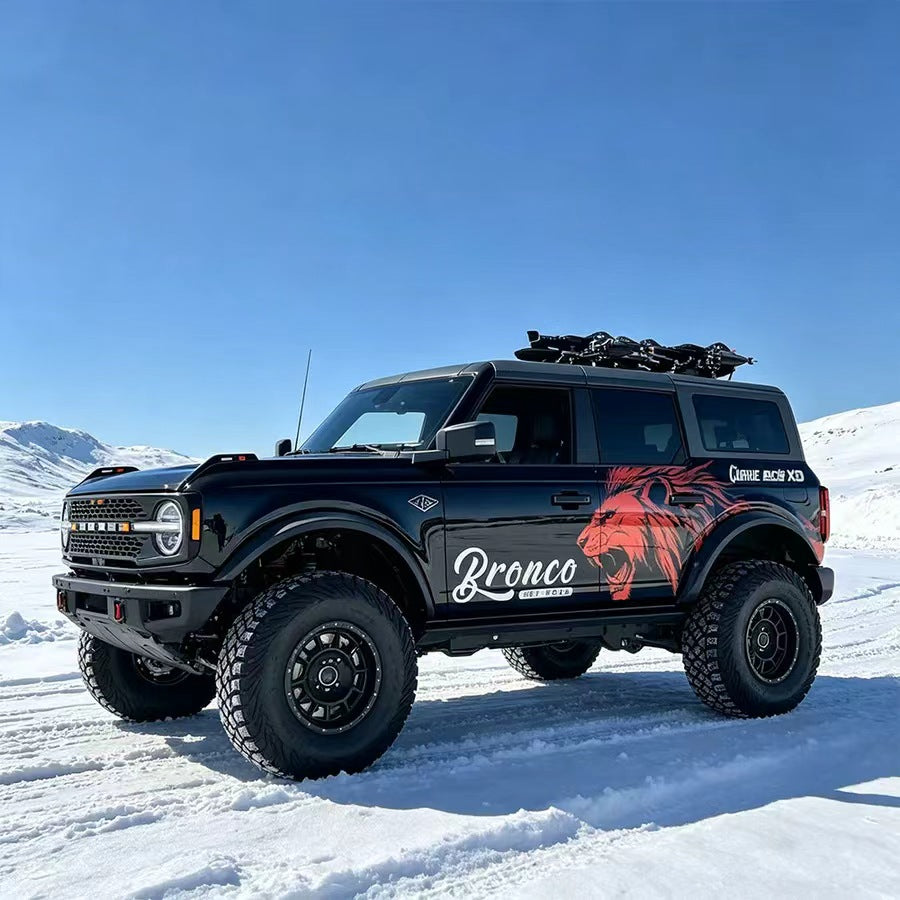 Black Ford Bronco with Red Lion Aggressive Animal Side Vinyl Wrap in Snow