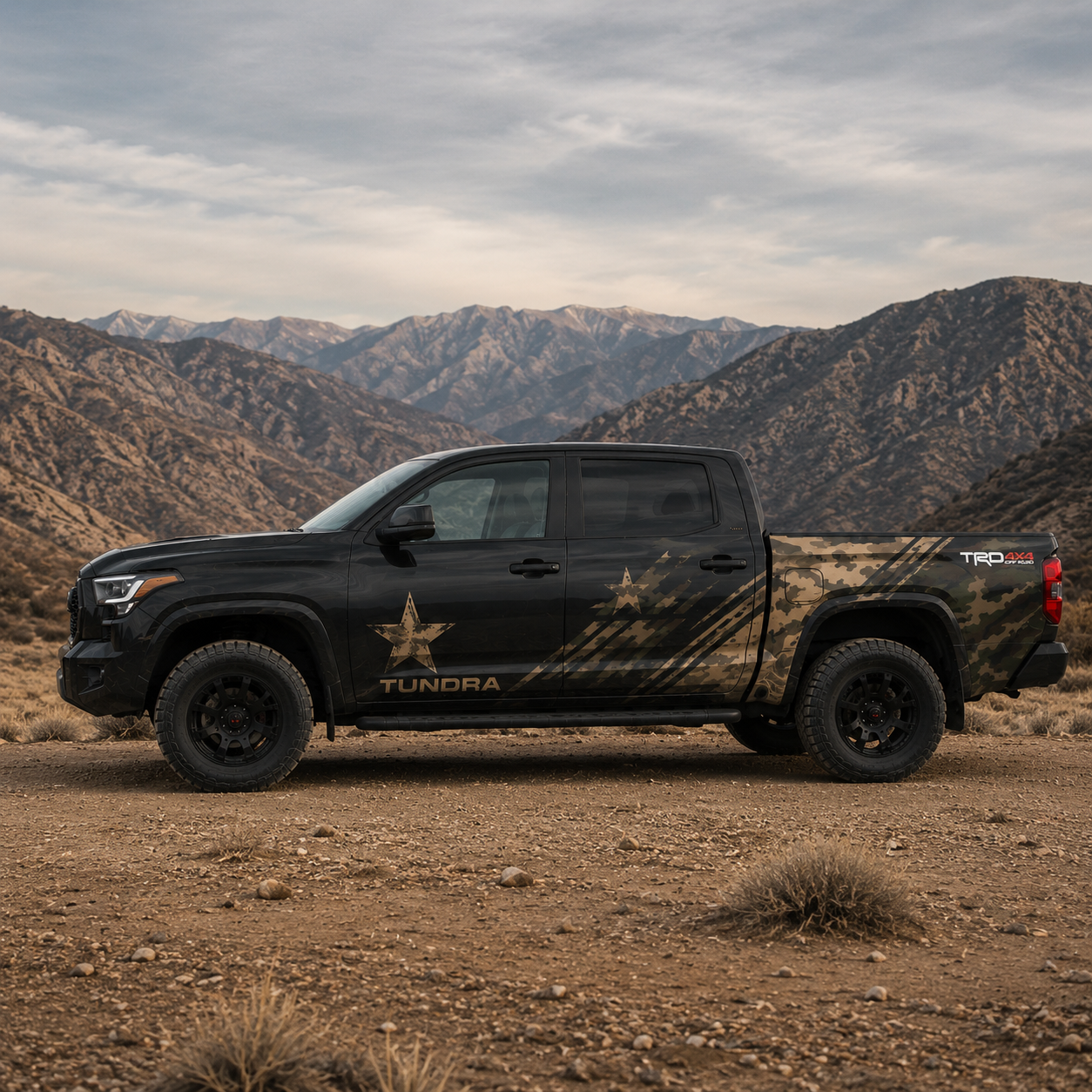 Toyota Tundra with Tactical Star full truck wrap side view in mountain terrain