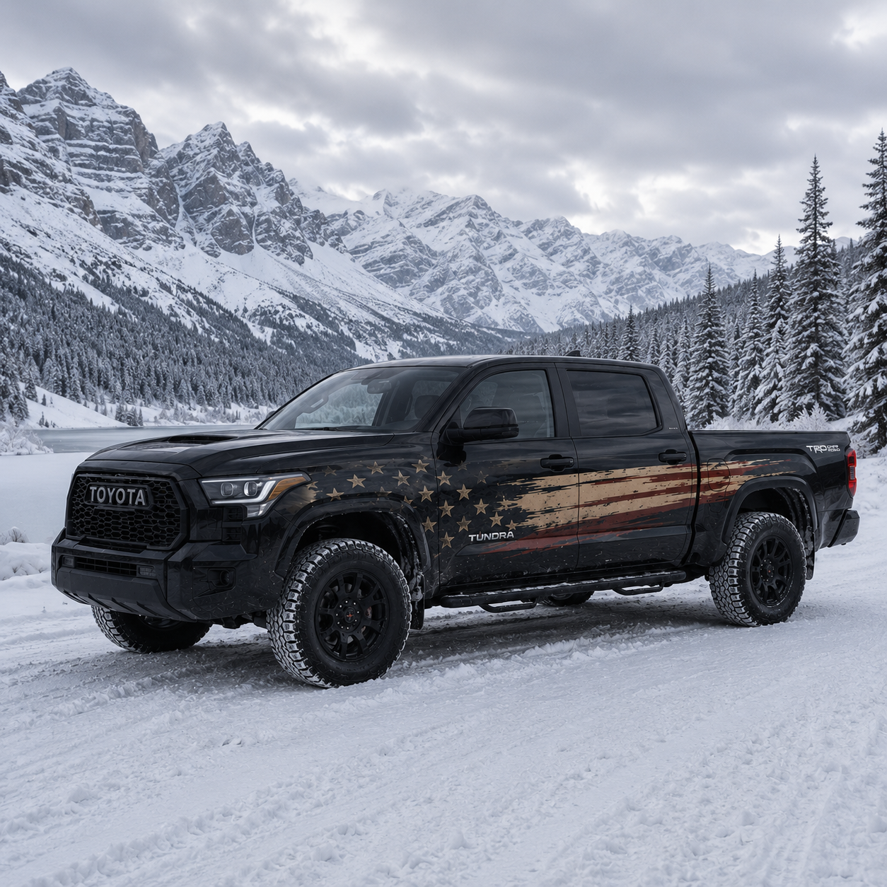 American Flag truck decal on black Toyota Tundra driving through snowy mountain landscape