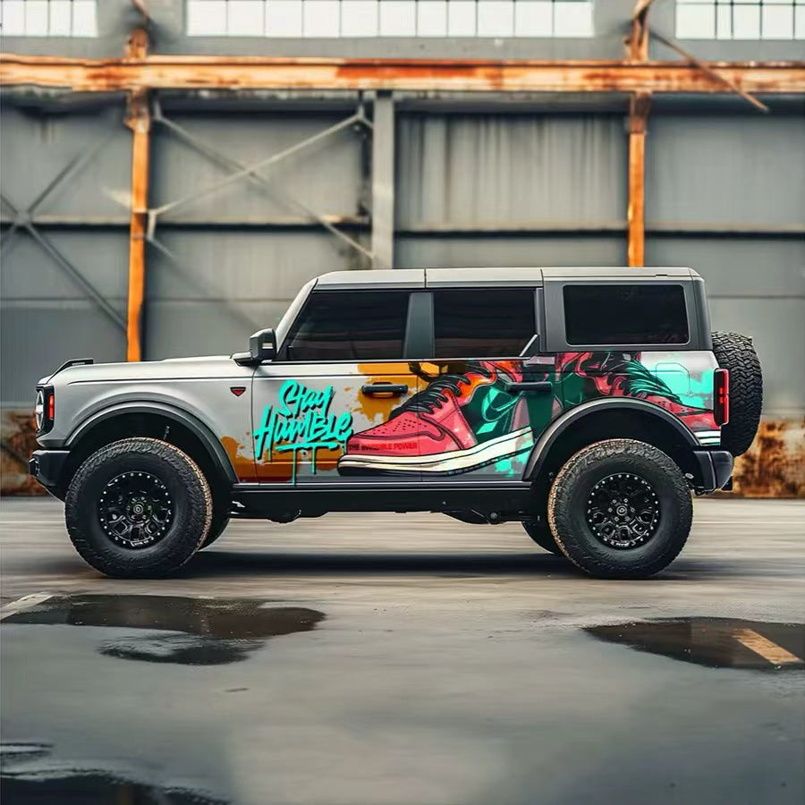 Colorful Street Art Vinyl Wrap on Ford Bronco – Full Side Graffiti Decal in Garage
