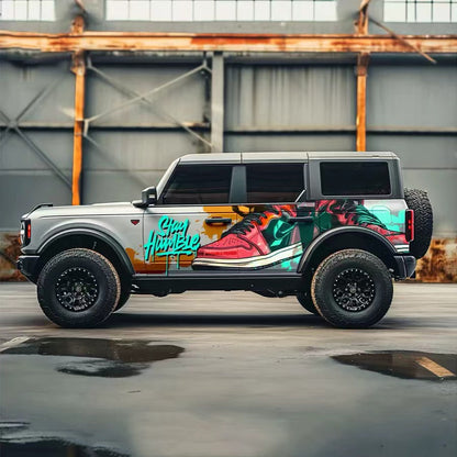 Colorful Street Art Vinyl Wrap on Ford Bronco – Full Side Graffiti Decal in Garage