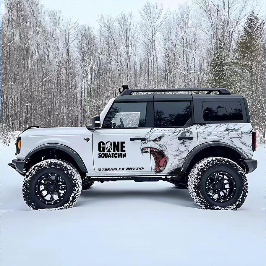 Arctic Wolf SUV Decal Wrap for Jeep Wrangler – Roaring Predator Off-Road Side Graphics on White Bronco in Snowy Forest