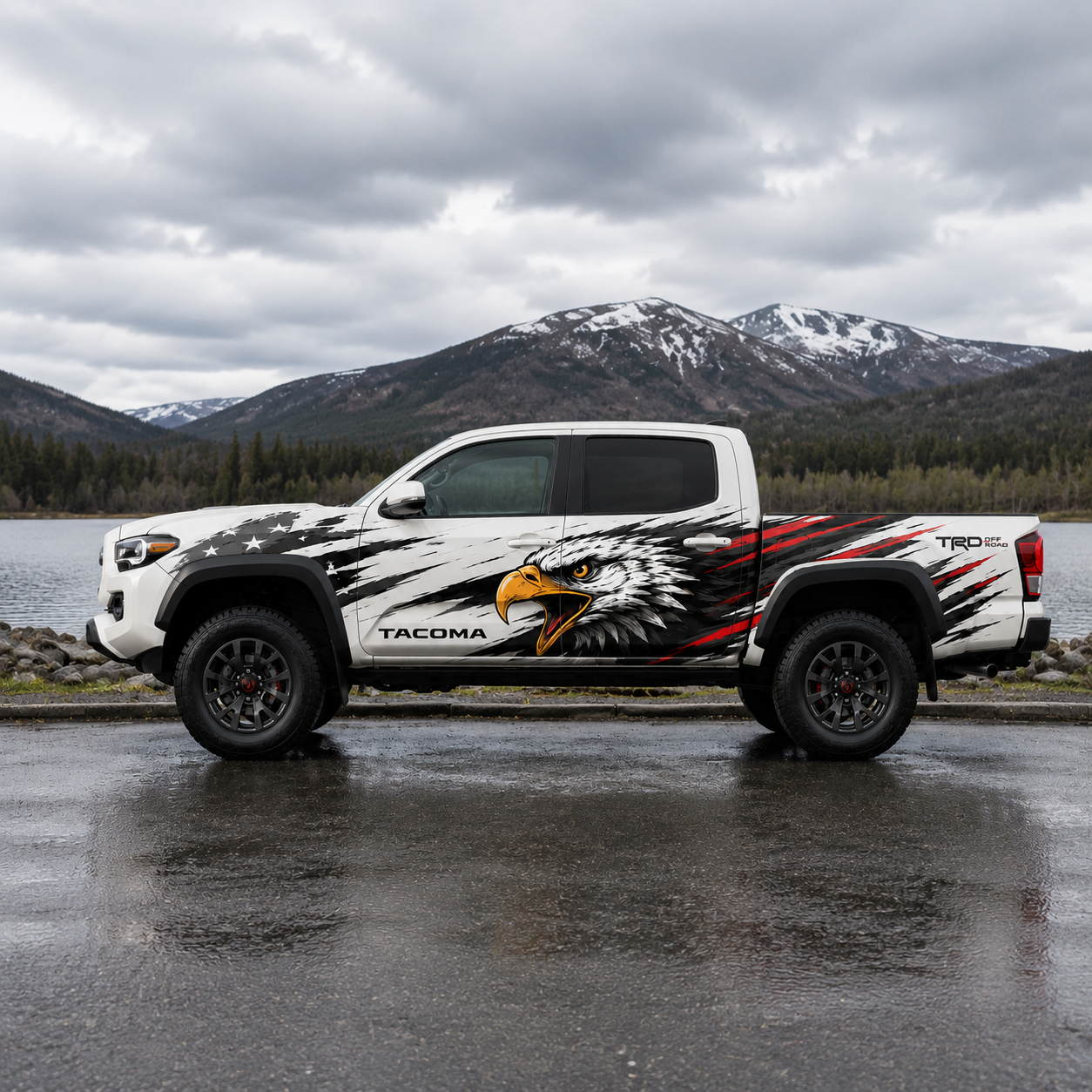 Patriotic eagle decal on white Toyota Tacoma with mountain lake background