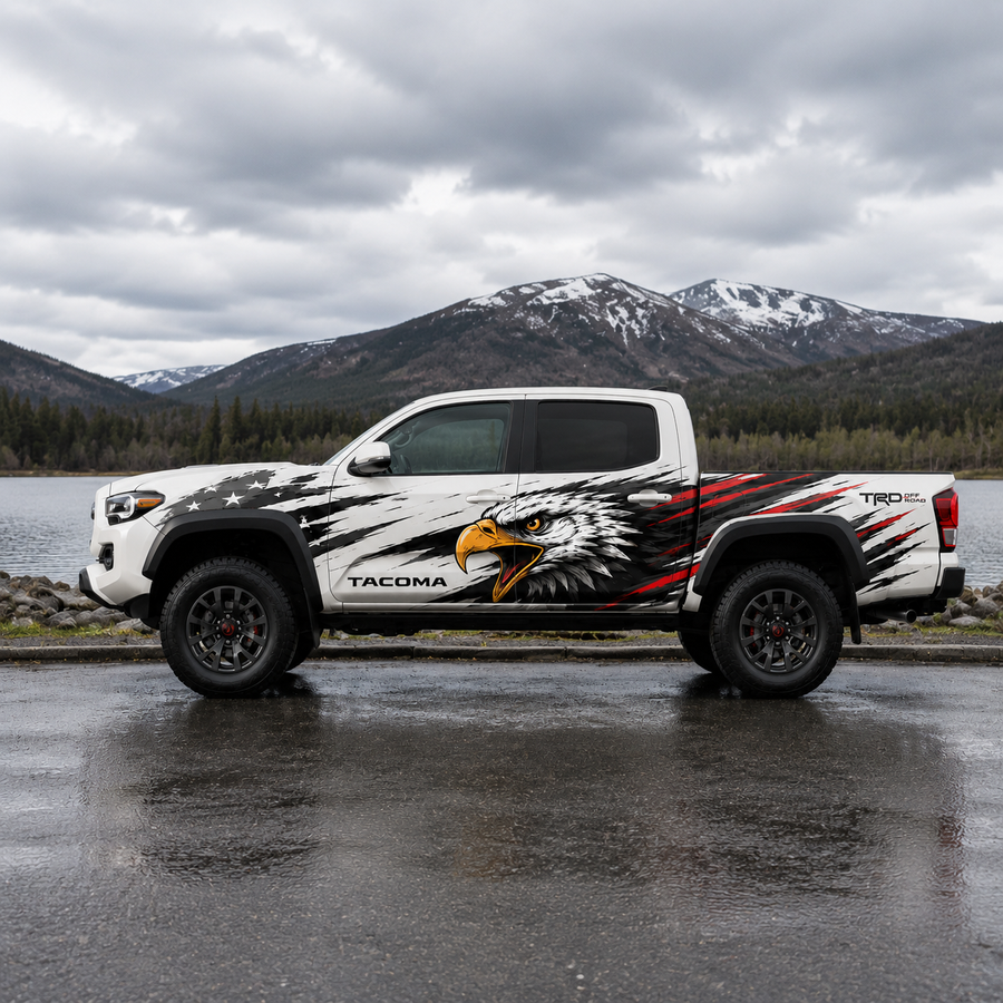 Patriotic eagle decal on white Toyota Tacoma with mountain lake background