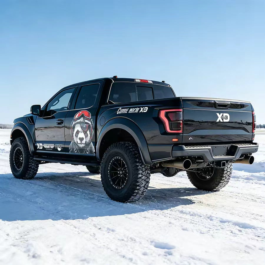 Pilot panda truck decal on black pickup – full side view in snowy outdoor setting