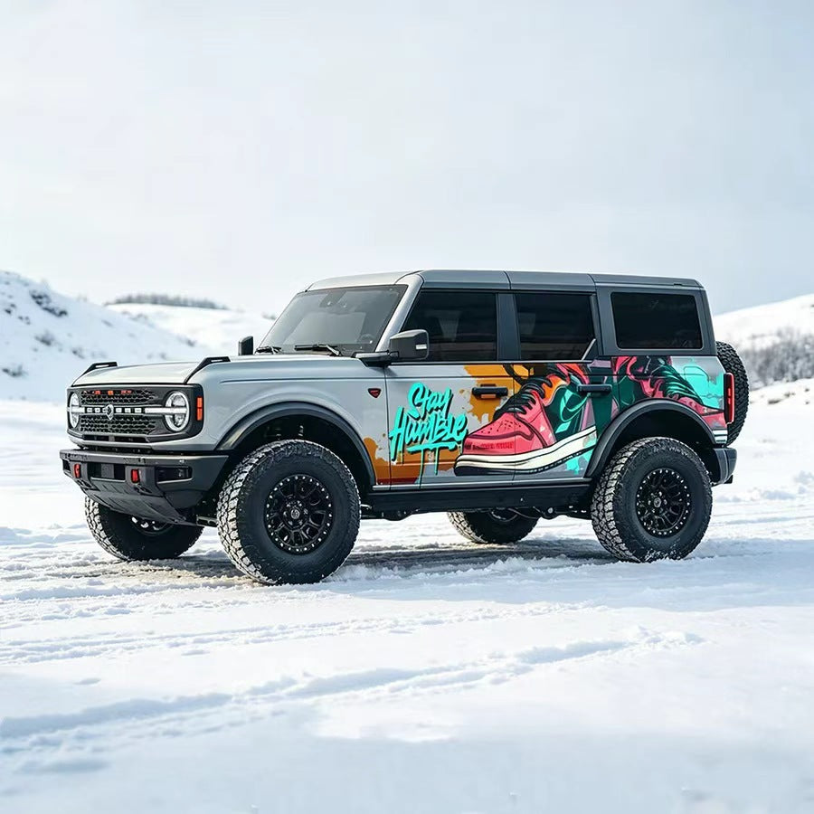 Ford Bronco with Graffiti Side Vinyl Wrap in Snow – Colorful Street Art Car Decal