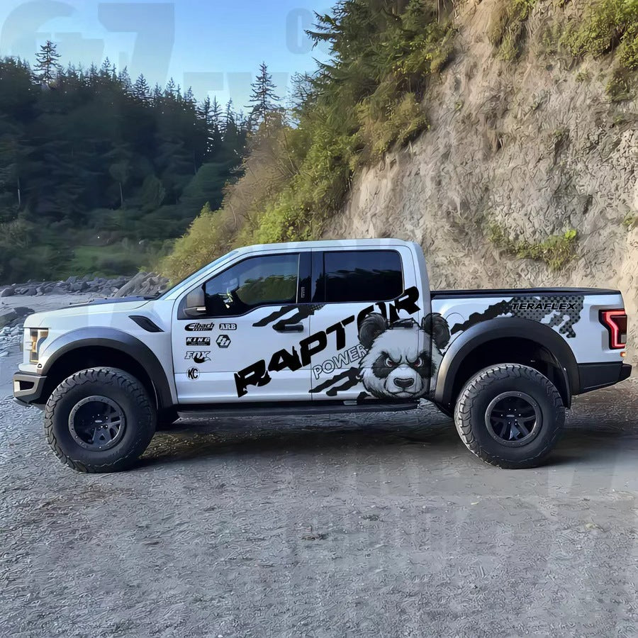 Black and white panda decal applied on pickup truck – outdoor mountain background side view