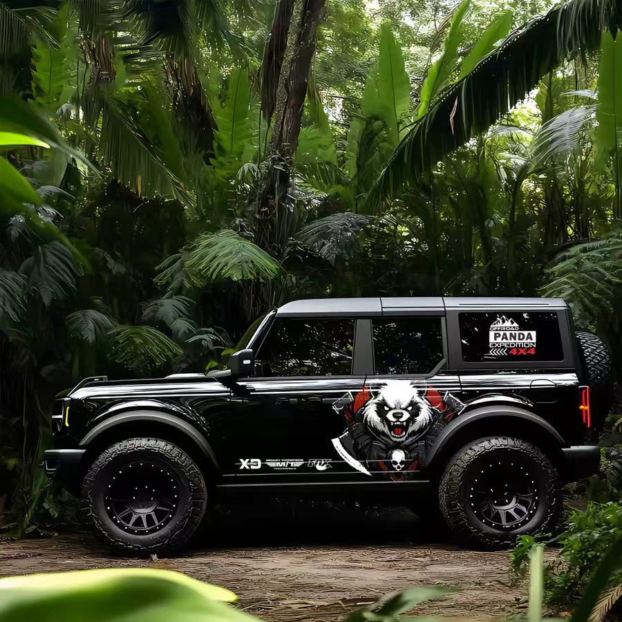 War panda skull vinyl wrap on black Ford Bronco SUV – battle style panda side graphic decal, jungle background