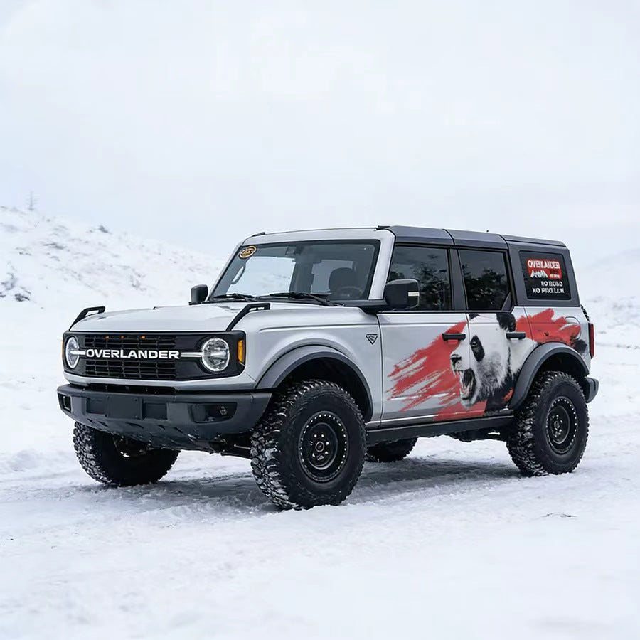 Red brush panda decal on white Bronco SUV – full side view with complete graphic wrap in outdoor setting