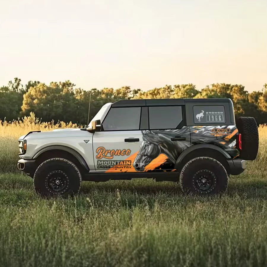 Wild Horse SUV Decal – Running Stallion Side Wrap Graphic on Black Ford Bronco in Grassland