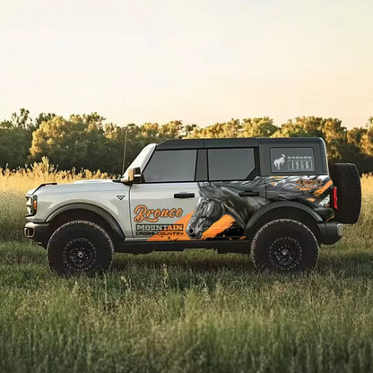 Wild Horse SUV Decal – Running Stallion Side Wrap Graphic on Black Ford Bronco in Grassland
