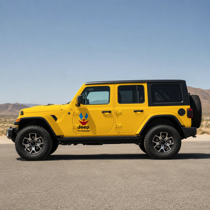 Clown face joker vinyl decal installed on yellow Jeep Wrangler Unlimited full side view in desert landscape