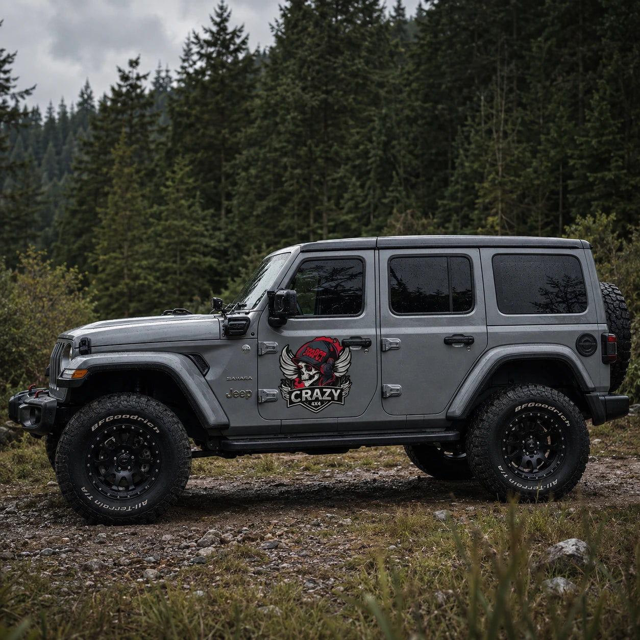 Crazy 4x4 300PCT skull vinyl decal on gray Jeep Wrangler Sahara full side view forest trail