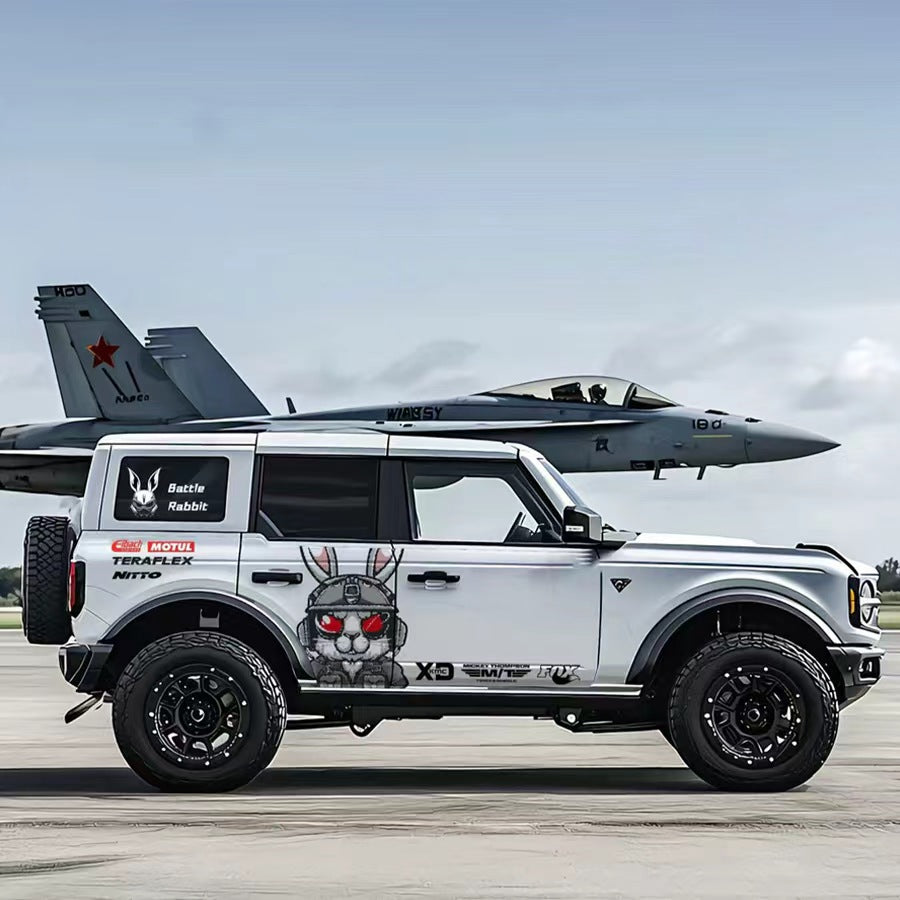 Tactical Rabbit Car Decal for Ford Bronco – Combat Bunny Off-Road Vinyl Wrap on White Bronco at Airport