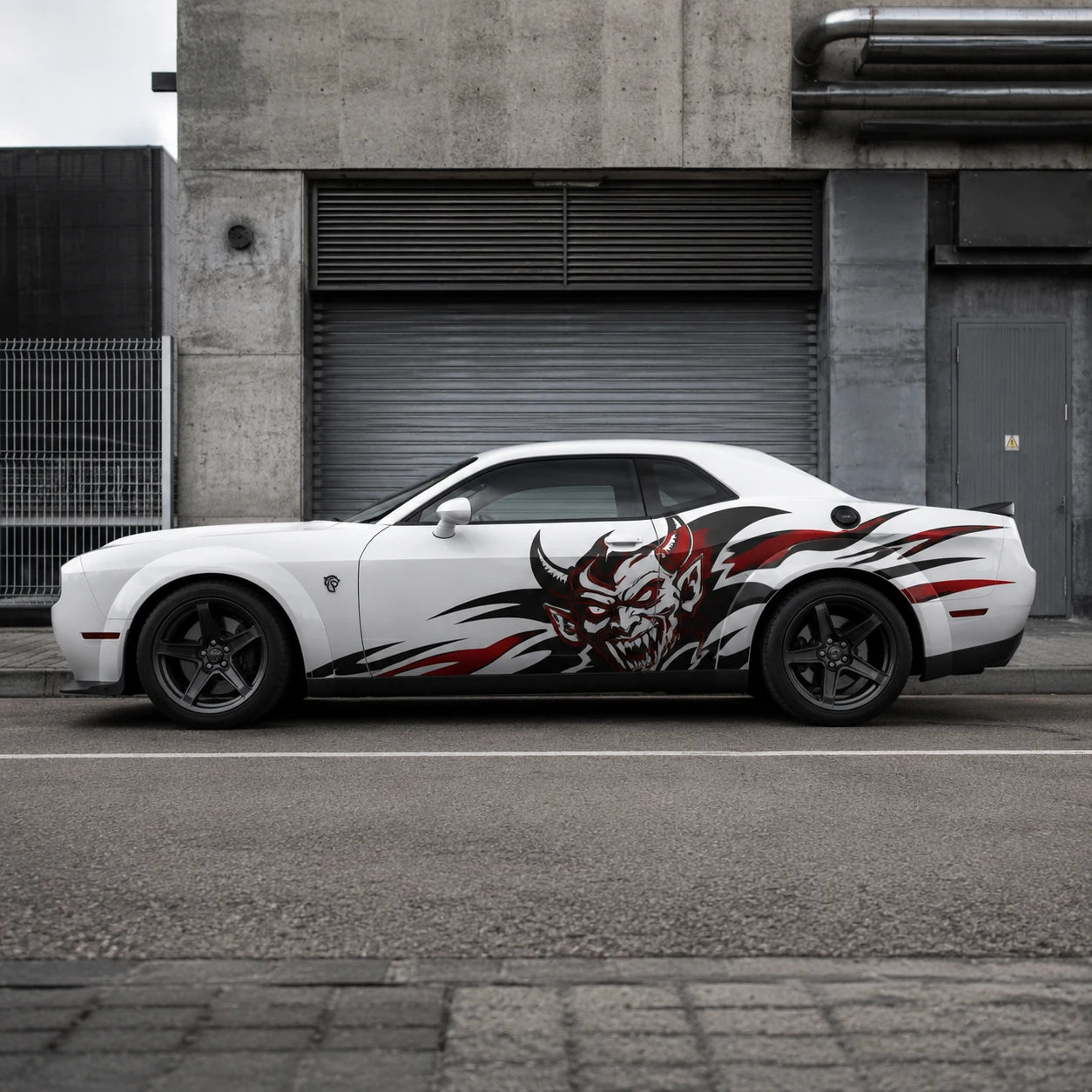 Devil tribal vinyl decal on white Dodge Challenger parked in urban setting