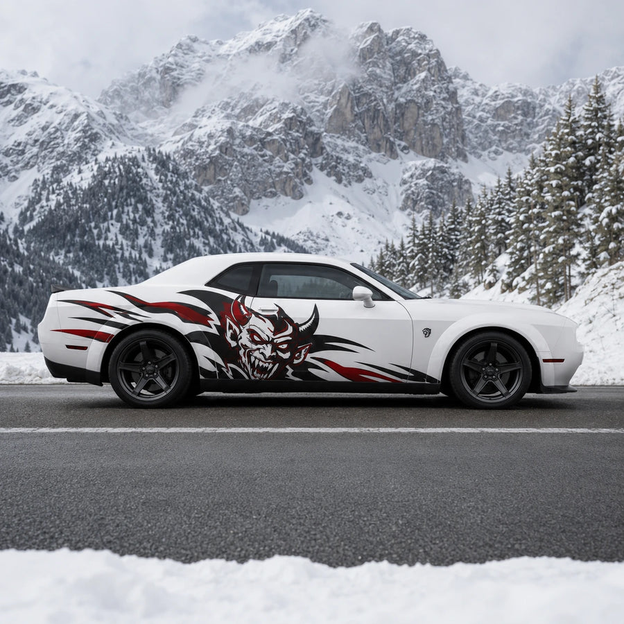 Devil tribal decal on white Dodge Challenger driving on winter mountain road