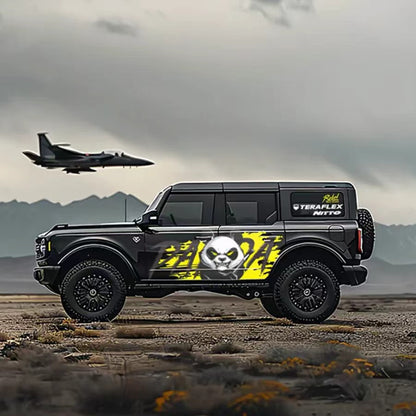 Aggressive panda graffiti vinyl wrap on black Jeep Wrangler SUV – neon yellow skull panda side graphic, coastal airfield background