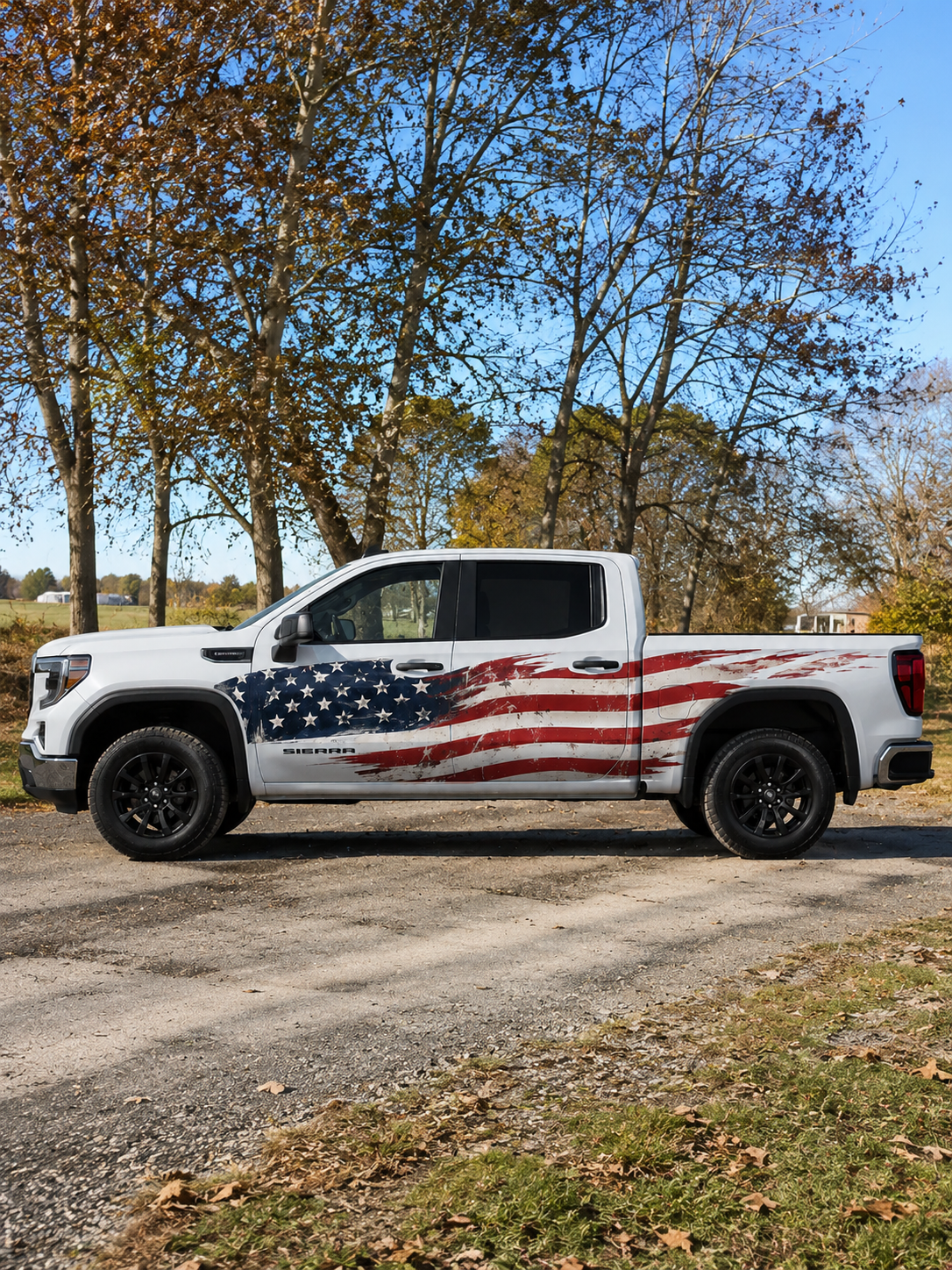 GMC Sierra truck with custom distressed American flag full side decal wrap — patriotic graphic design by WEEM Custom