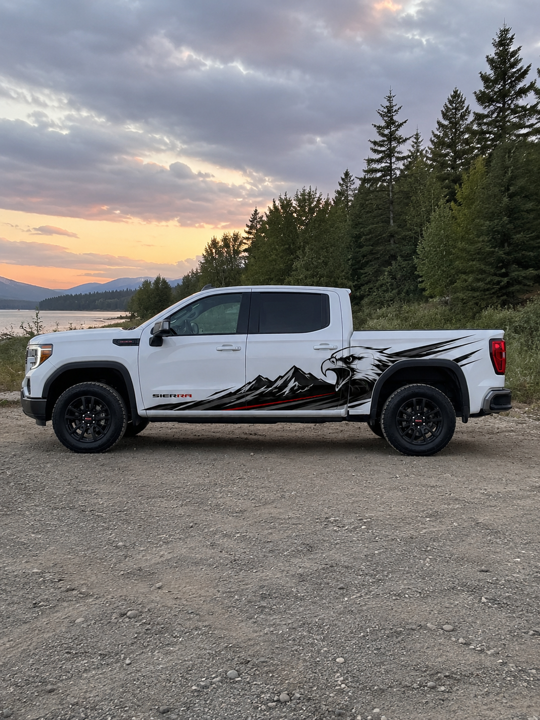 GMC Sierra truck with custom eagle and mountain side decal wrap — black and red graphic design by WEEM Custom