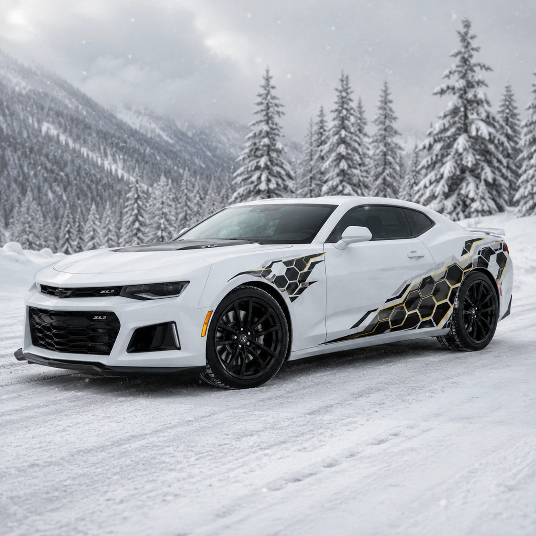 White Chevrolet Camaro ZL1 with honeycomb hex side decal – front 3/4 view in snowy winter forest landscape