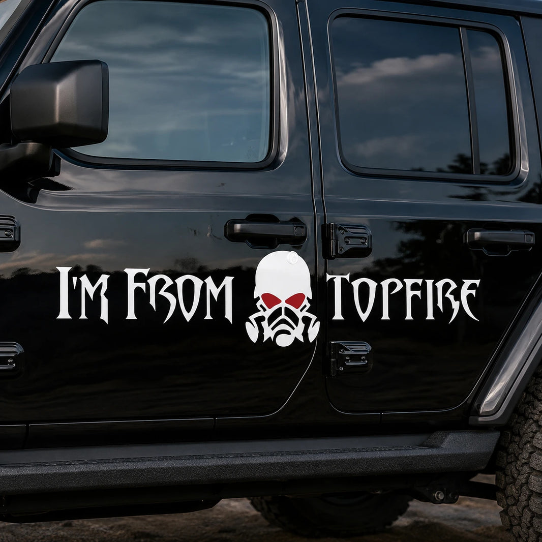 I'm From Topfire skull vinyl banner decal installed on black Jeep Wrangler 4-door side panel close-up