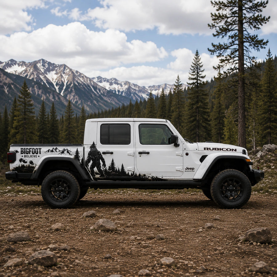 Jeep Gladiator Bigfoot decal – passenger side view in forest mountain setting