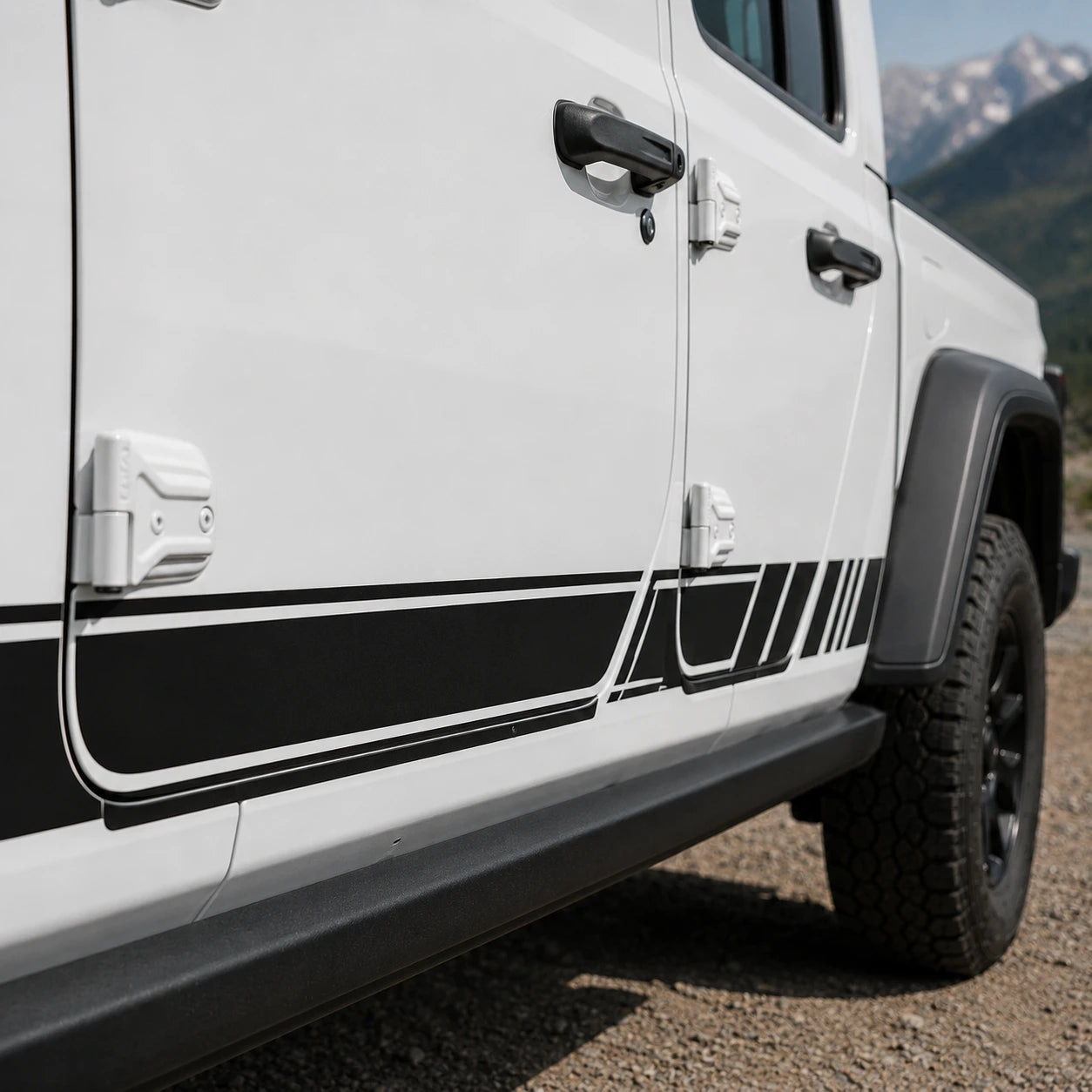 Jeep Gladiator racing stripe decal – close-up rocker panel detail on white truck in mountain terrain