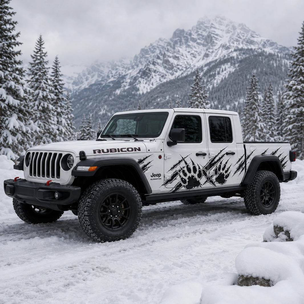 Jeep Gladiator Rubicon bear claw scratch decal – front 3/4 view in snowy alpine mountain setting