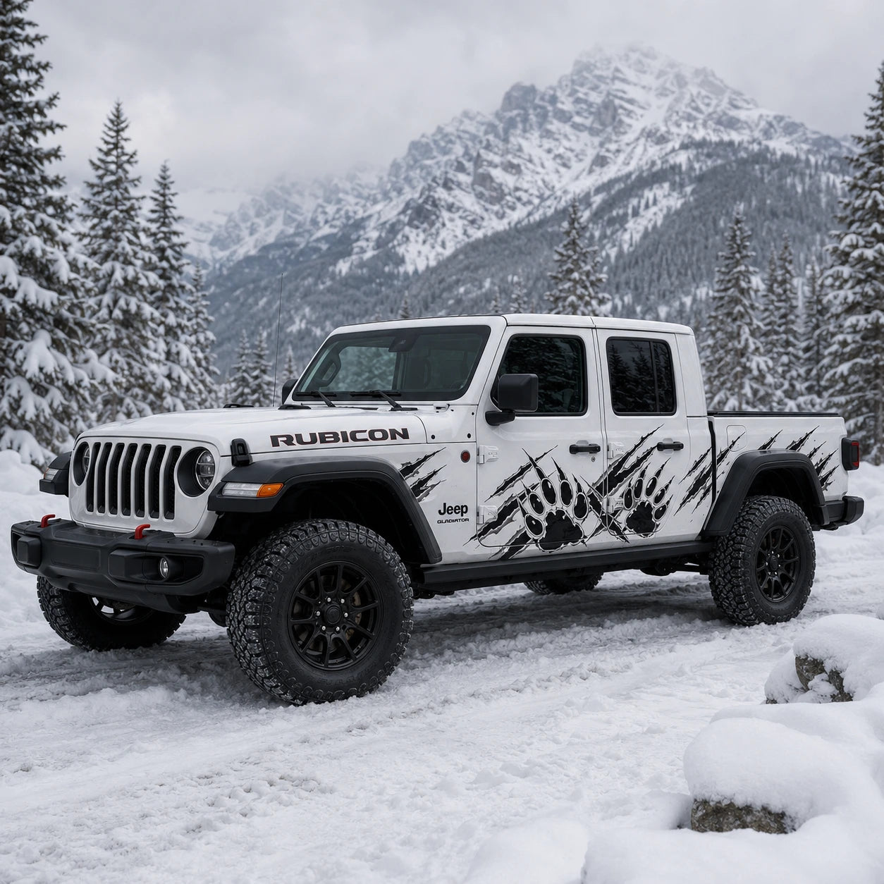 Jeep Gladiator Rubicon bear claw scratch decal – front 3/4 view in snowy alpine mountain setting