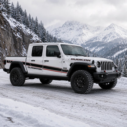Jeep Gladiator Rubicon sport stripe decal kit – front 3/4 view on snowy mountain canyon road