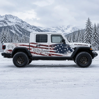 Jeep Gladiator Rubicon We The People 1776 American flag decal – full passenger side view in snowy mountain pine forest setting