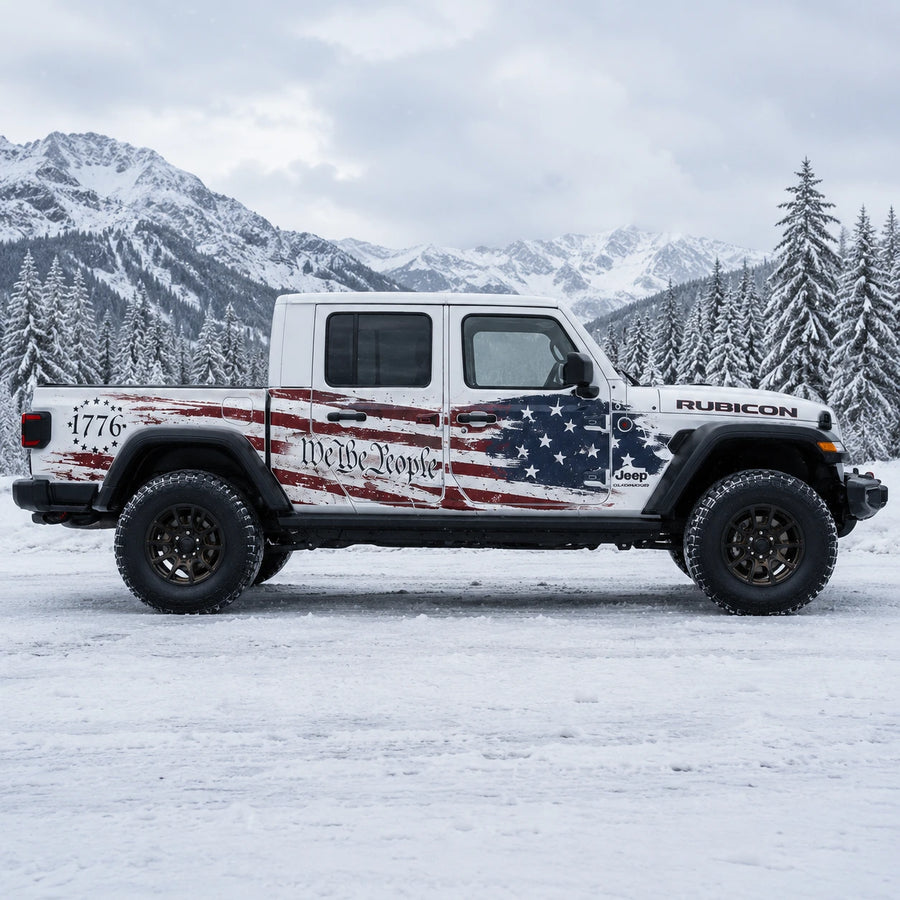Jeep Gladiator Rubicon We The People 1776 American flag decal – full passenger side view in snowy mountain pine forest setting