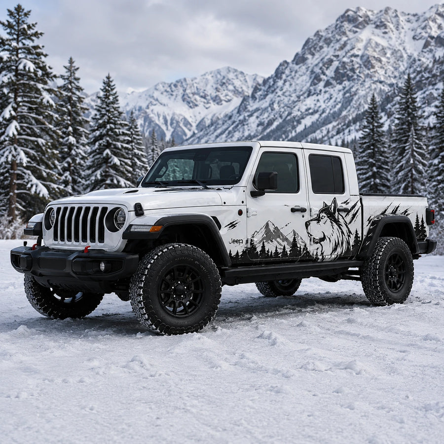 Jeep Gladiator Rubicon wolf mountain decal kit – front 3/4 view in snowy pine forest setting