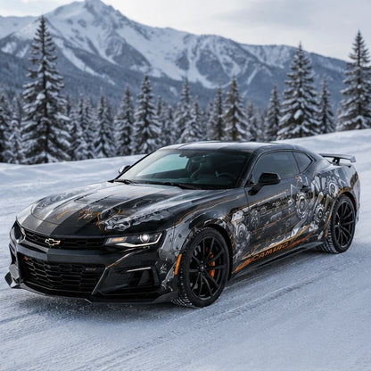 Black Chevrolet Camaro ZL1 with mechanical gear side decal – front 3/4 view in snowy winter mountain landscape