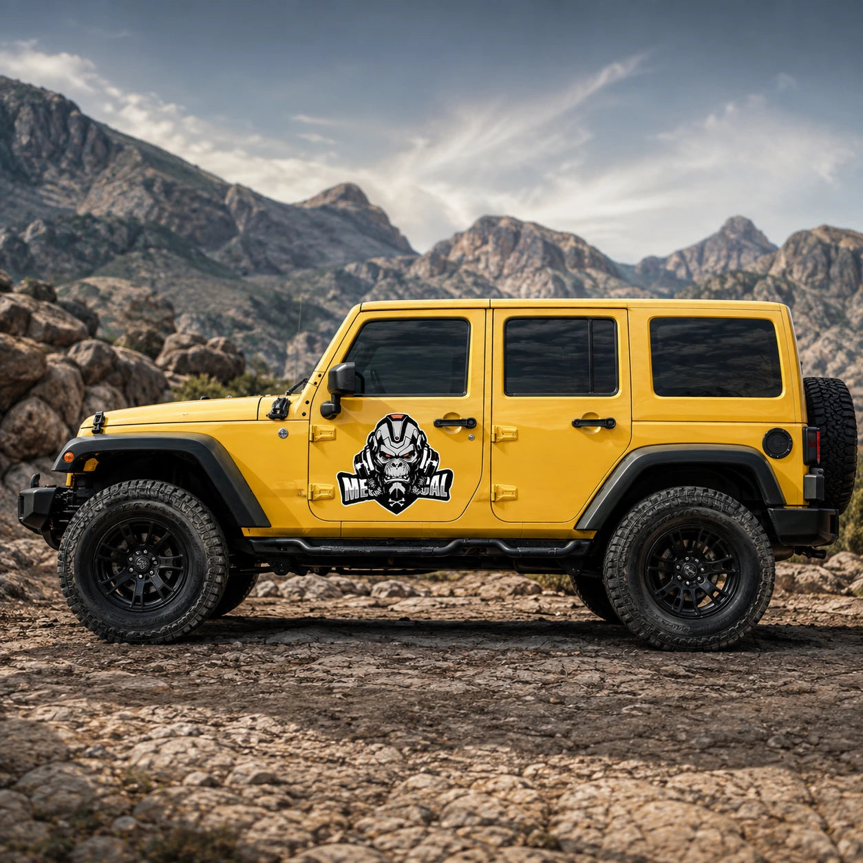 Mechanical Gorilla vinyl decal on yellow Jeep Wrangler full side view mountain trail background