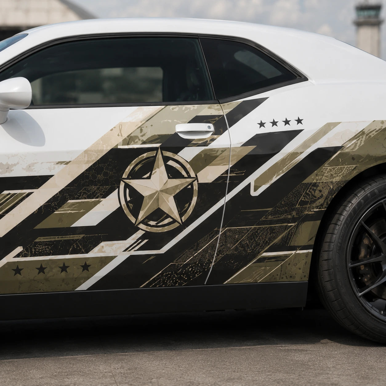 Military star camo side decal on white Dodge Challenger parked on airfield tarmac
