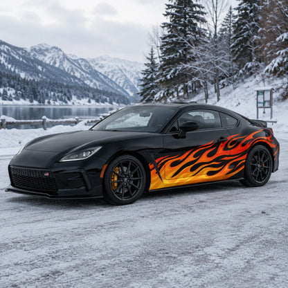 Black Toyota GR86 with orange red flame car side decal – front 3/4 view by snowy alpine mountain lake