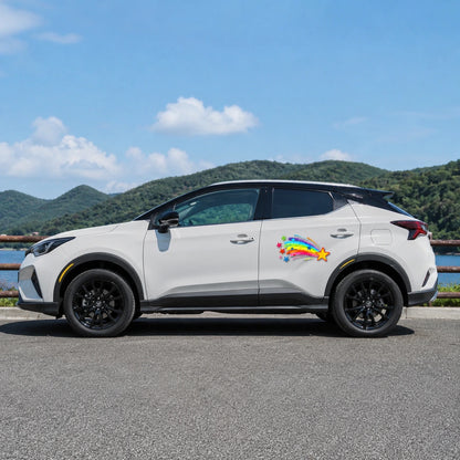 Rainbow shooting star vinyl decal installed on white Toyota SUV full side view by lakeside