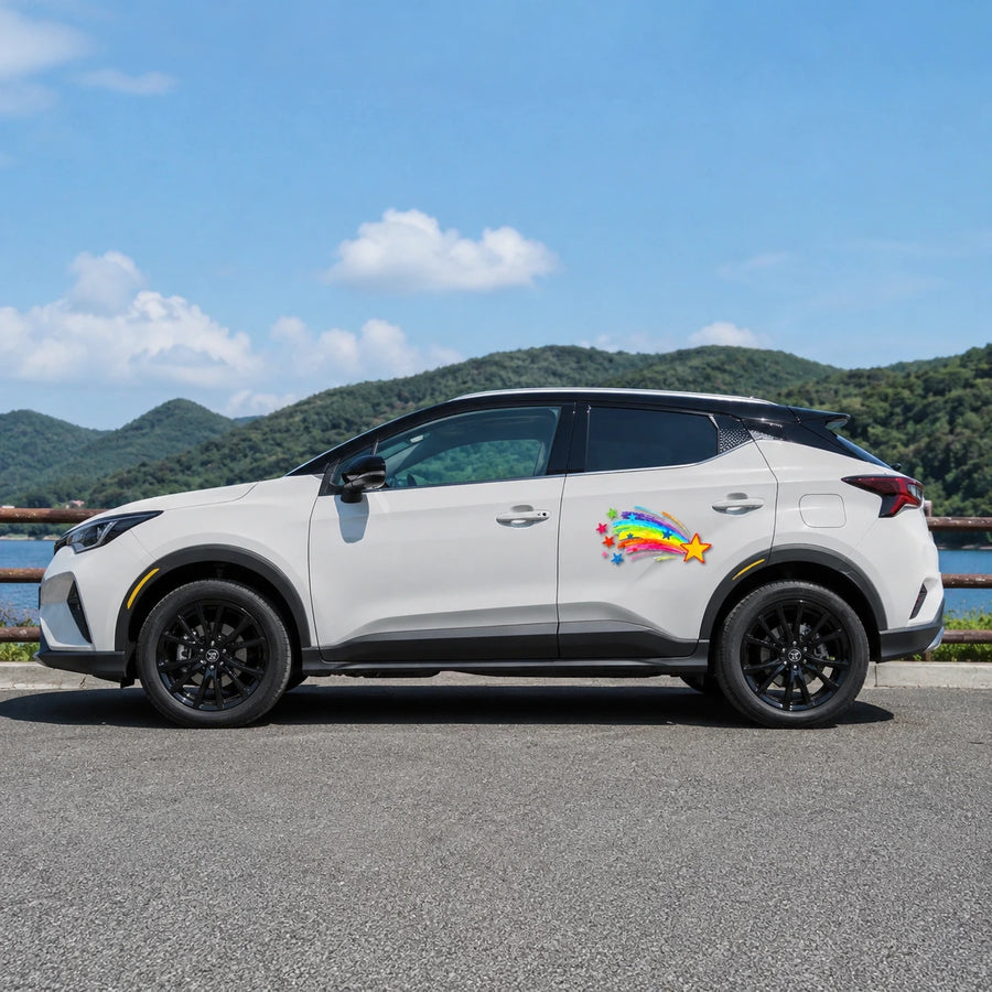 Rainbow shooting star vinyl decal installed on white Toyota SUV full side view by lakeside