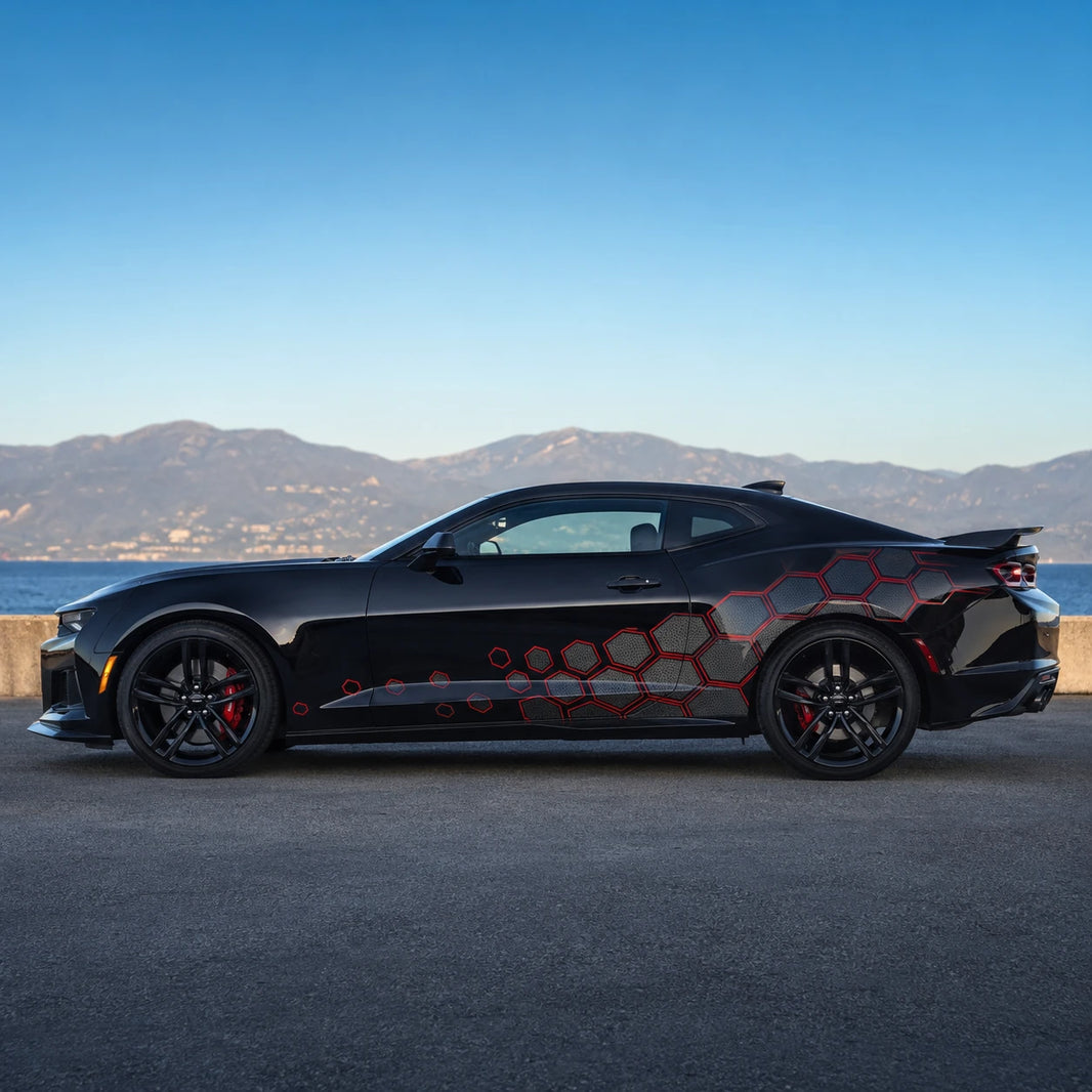 Black Chevrolet Camaro ZL1 with red hex honeycomb side decal – full side profile by Mediterranean coastal road at dusk
