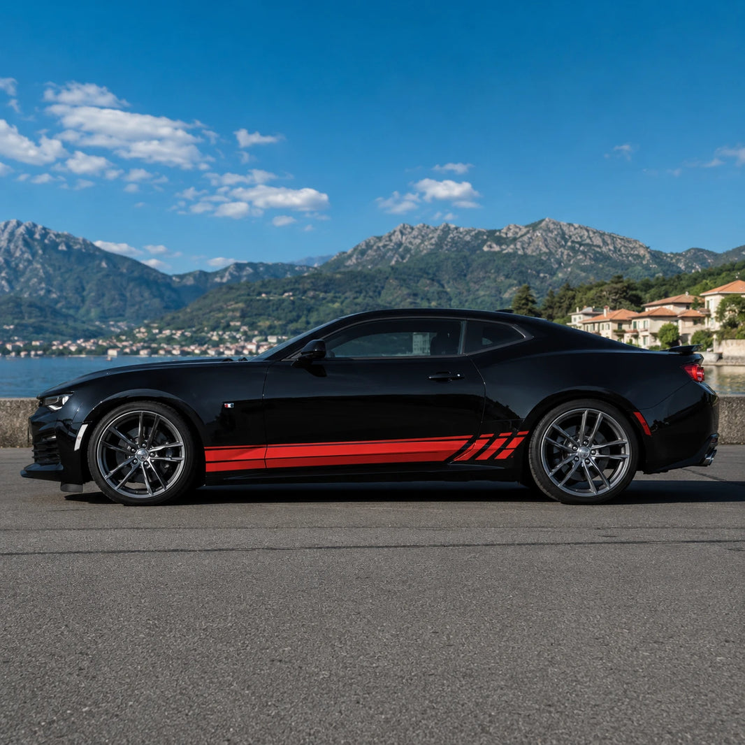 Black Chevrolet Camaro with red racing stripe side decal – full side profile by Italian lake and mountain backdrop