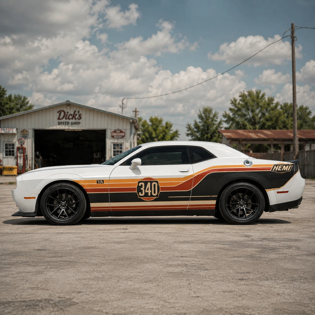 Retro racing stripe decal on white Dodge Challenger parked at vintage speed shop