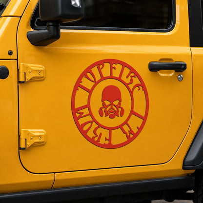 Red skull gas mask circle vinyl decal close-up on yellow Jeep Wrangler door panel