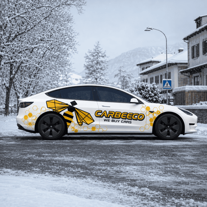 Tesla Model 3 bee theme side decal full side view in snowy mountain town with honeybee graphic prominently displayed