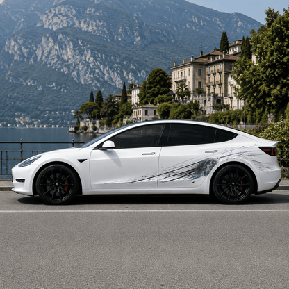 Tesla Model 3 with Lunar Impact moon crater side decal full side view parked by Italian lake with mountain backdrop